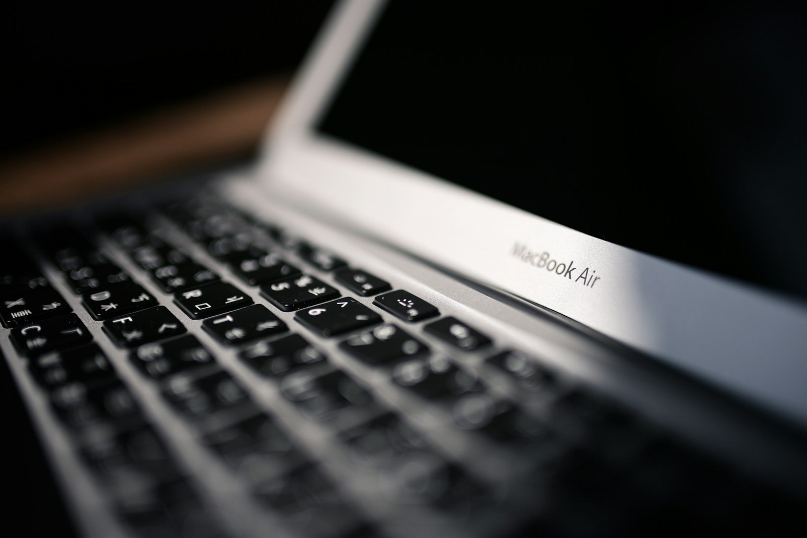 macbook air on brown wooden table